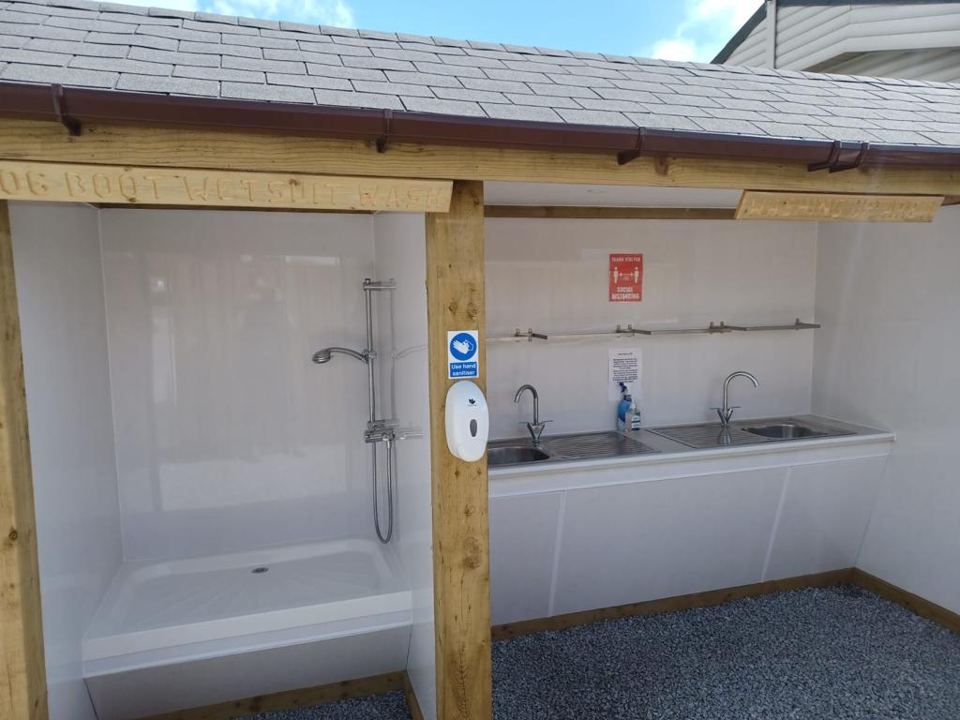 Outdoor shower block with basins
