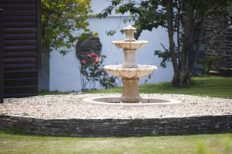 Stone fountain in the garden