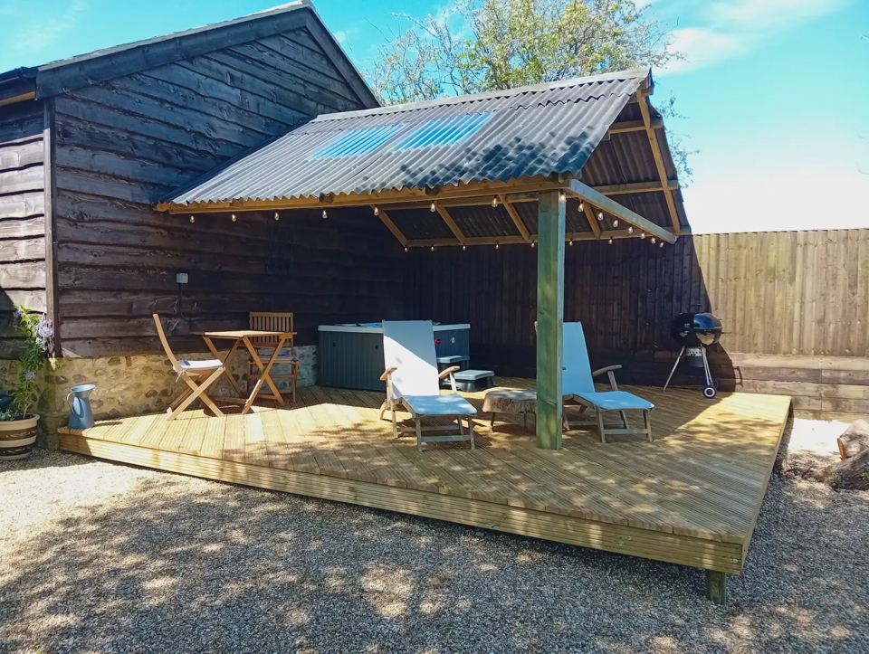 Covered deck with hot tub