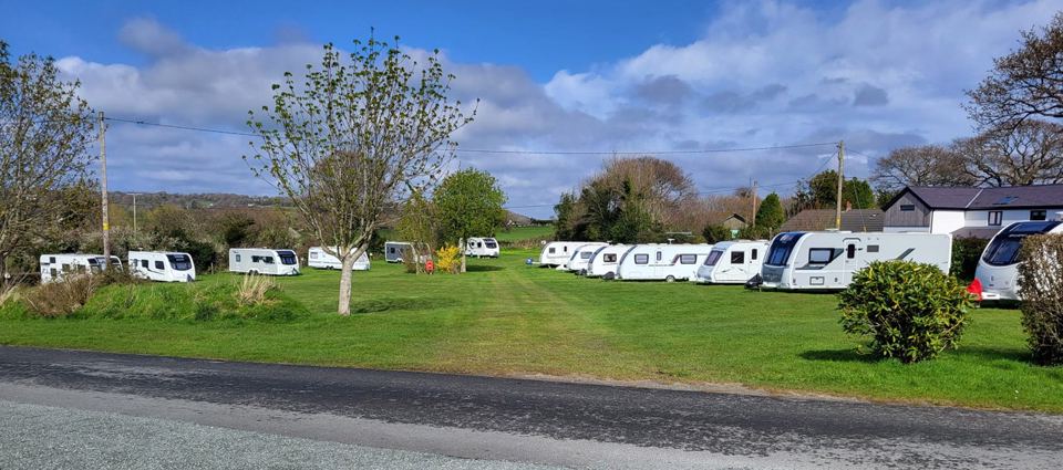 Tourers along the grass pitches