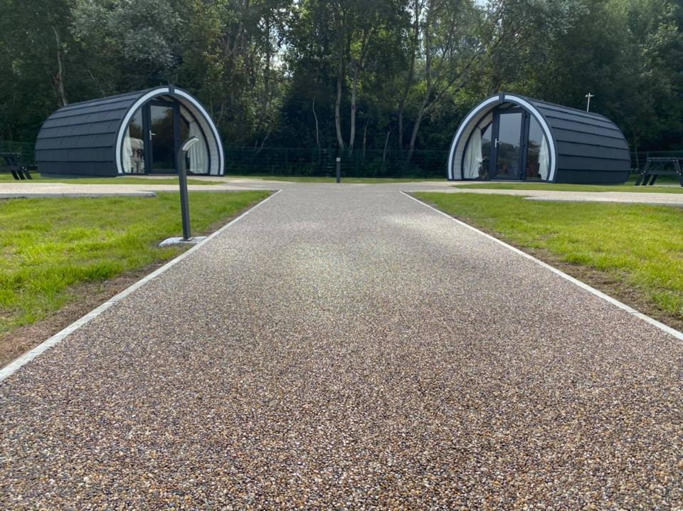 Pods along a gravel path