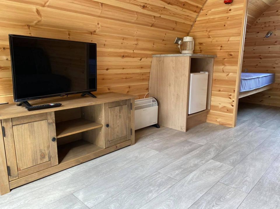 Pod with TV and fridge