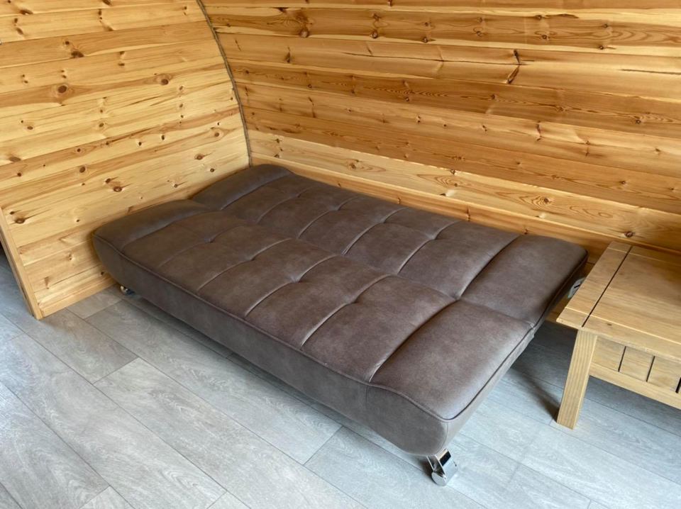 Sofa bed inside a pod