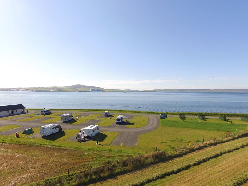 Motorhome pitches beside the bay