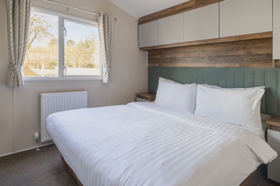 Bedroom with wooden headboard