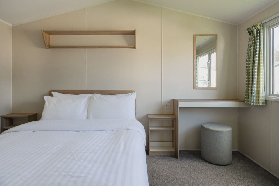 Bedroom with double bed and desk