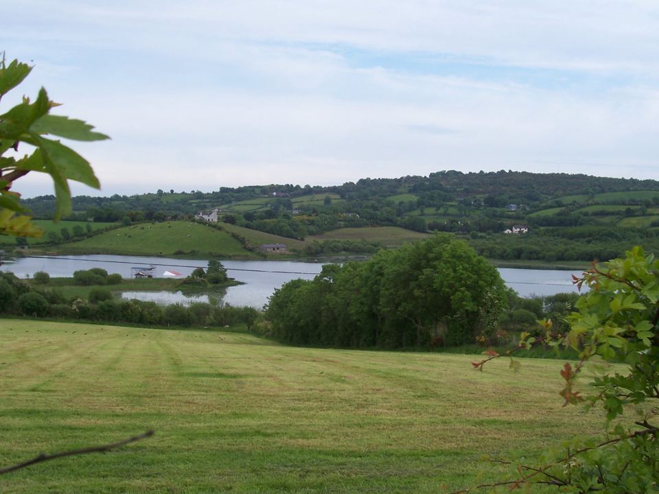 Grass slope down to the lough