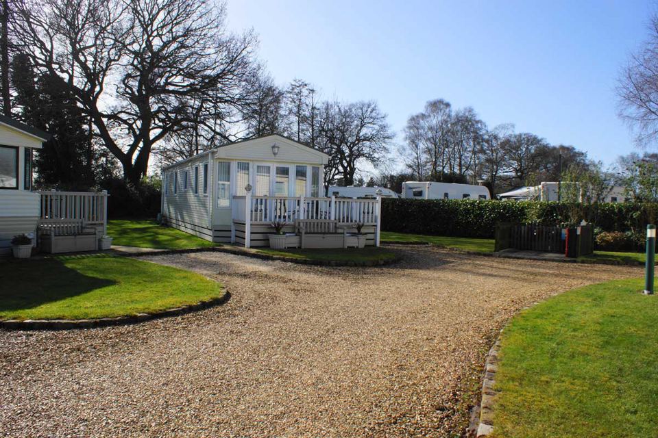 Static caravan on gravel drive