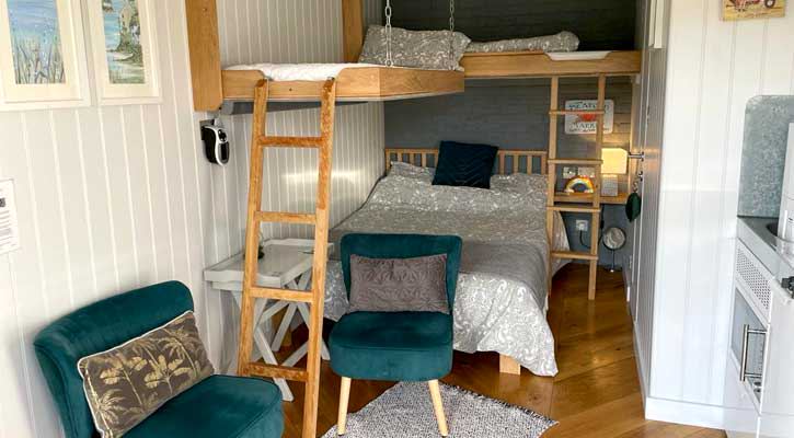Bunk beds and armchairs in the cabin