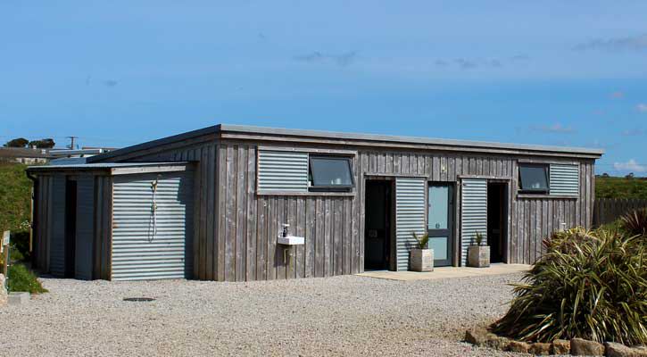 Wooden toilet block on the gravel