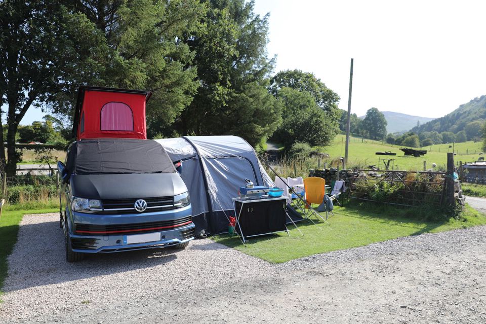 Campervan with awning on hardstanding