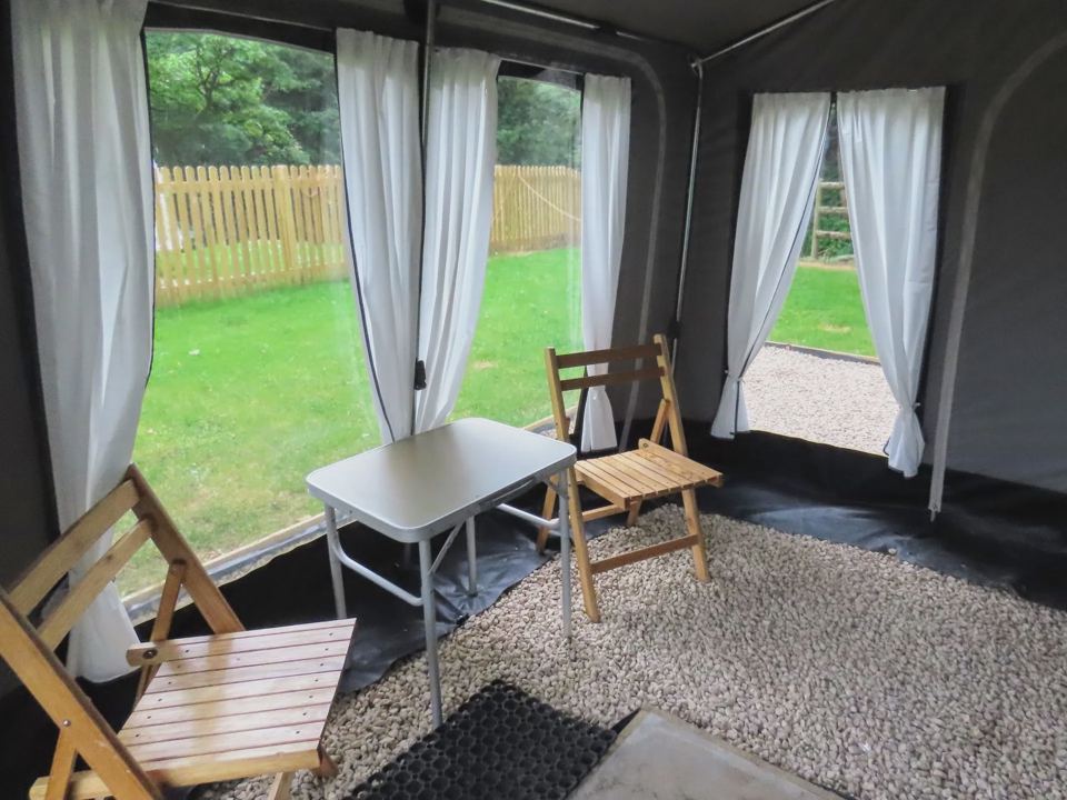 Awning with table and chairs