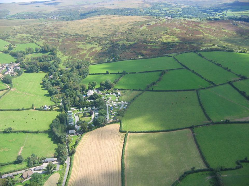 Aerial view over fields and hills