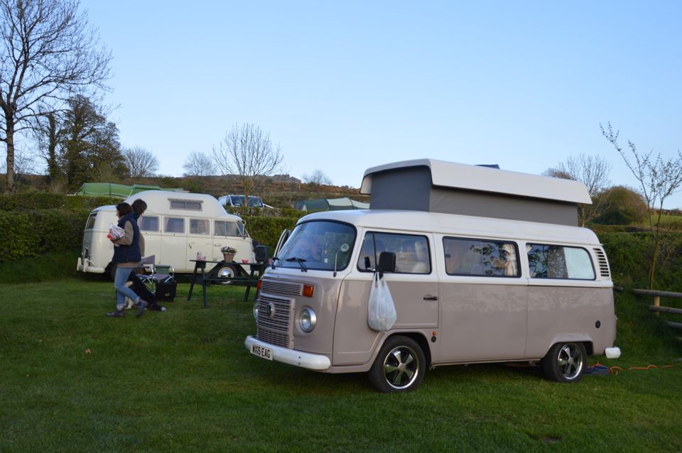 Campervan and caravan on grass