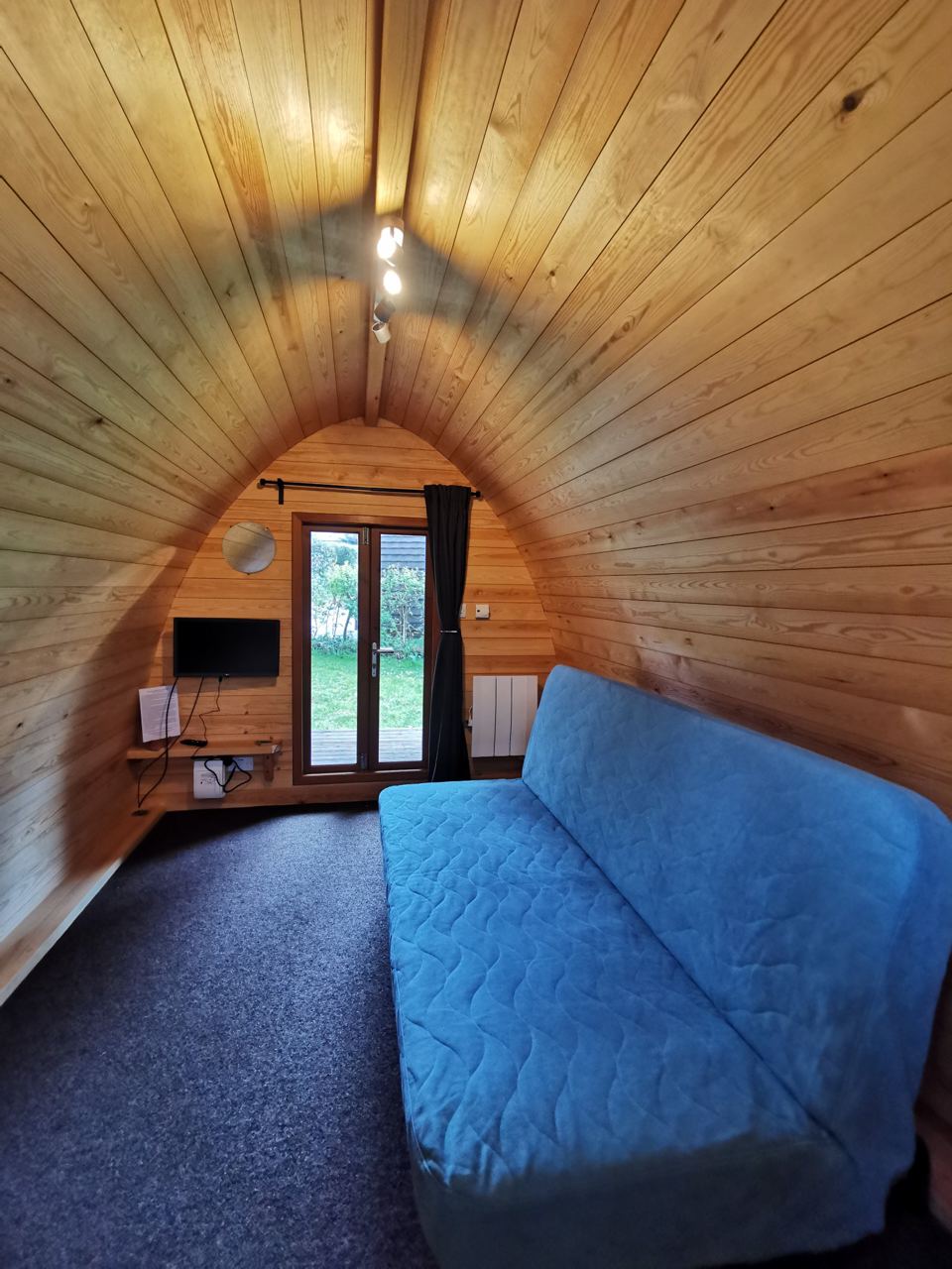 Inside the pod with blue sofa