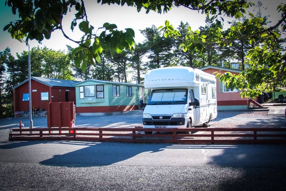 Motorhome beside holiday caravans