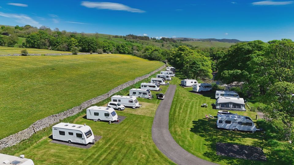 Hardstanding pitches by the wall