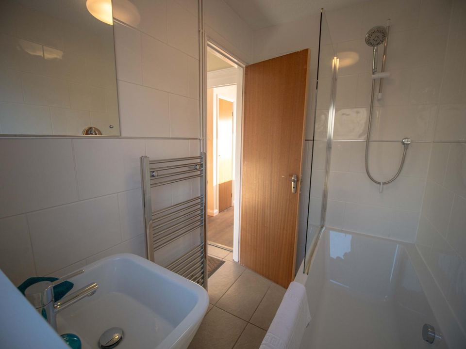 Bathroom with shower over the bath