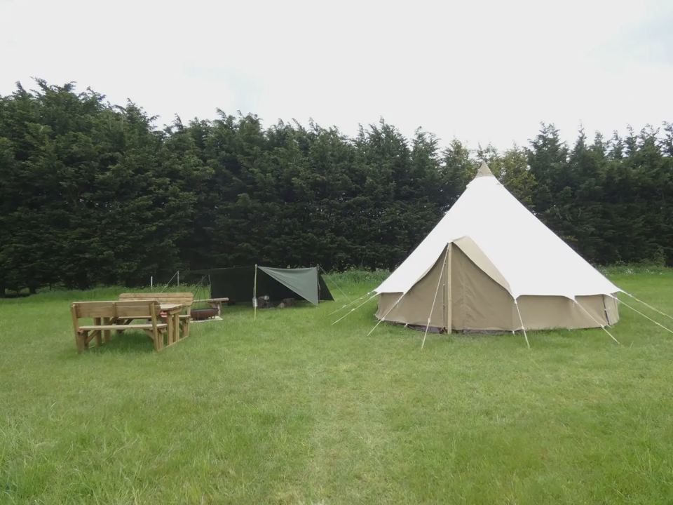 Bell tent and picnic benches