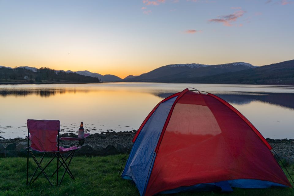 Tent on the shore at dusk