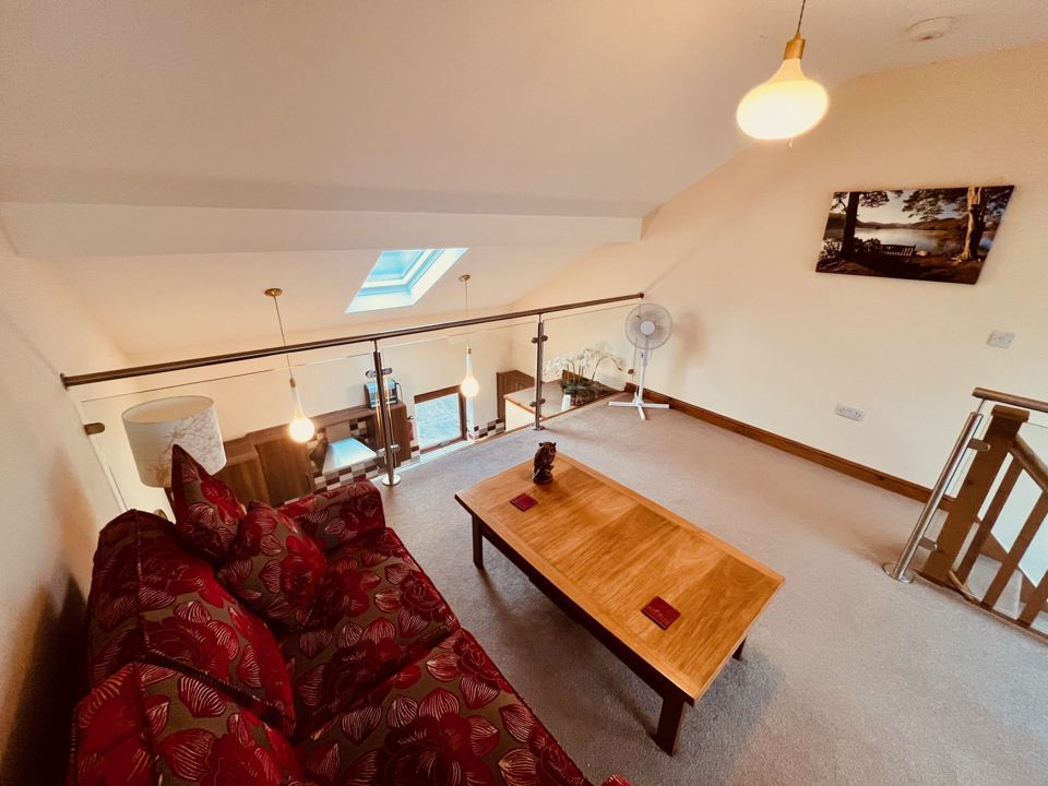 Upstairs lounge with sofa