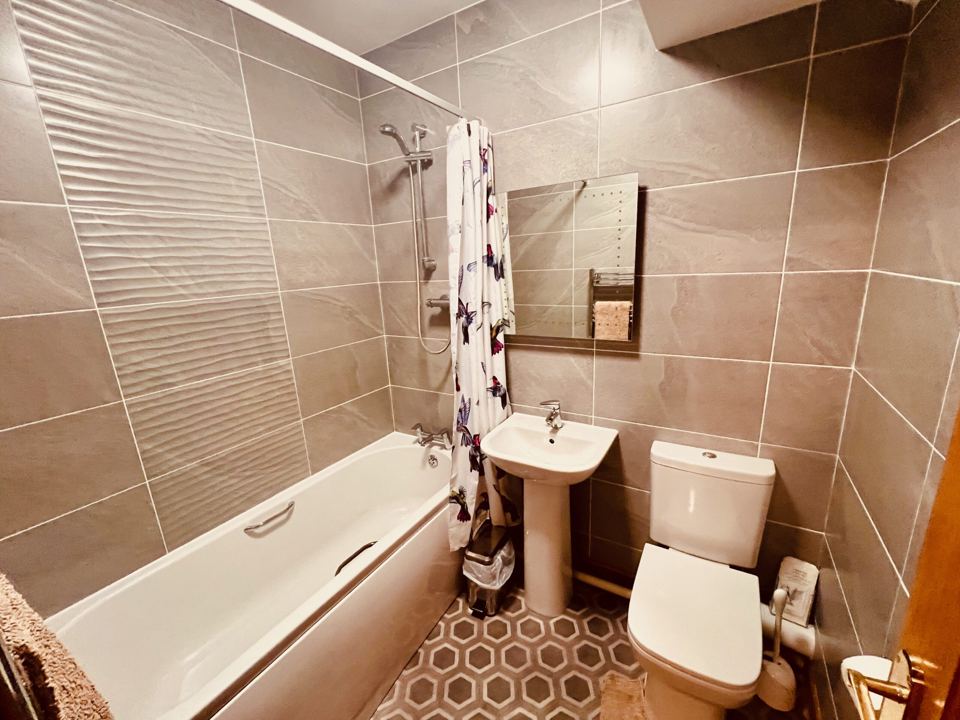 Bathroom with bath and shower