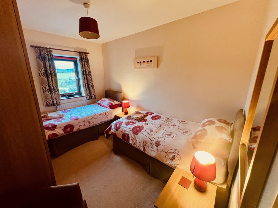Twin bedroom with lamp