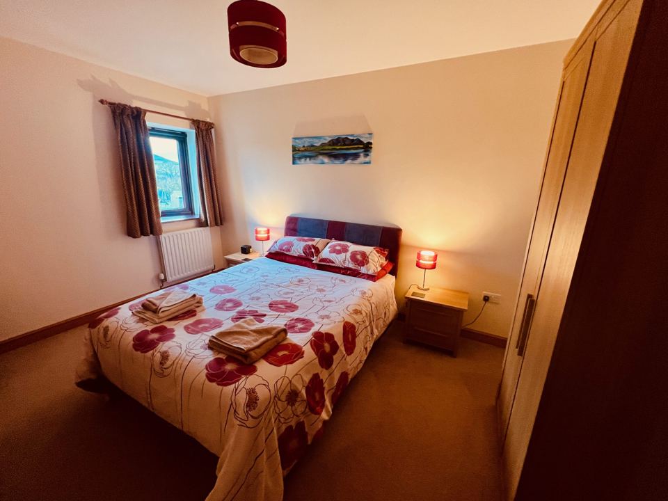 Double bedroom with floral bedding