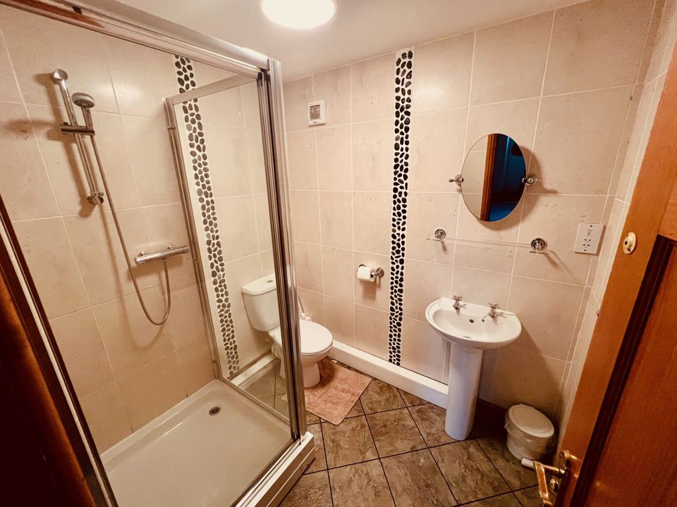 Shower room with toilet and basin