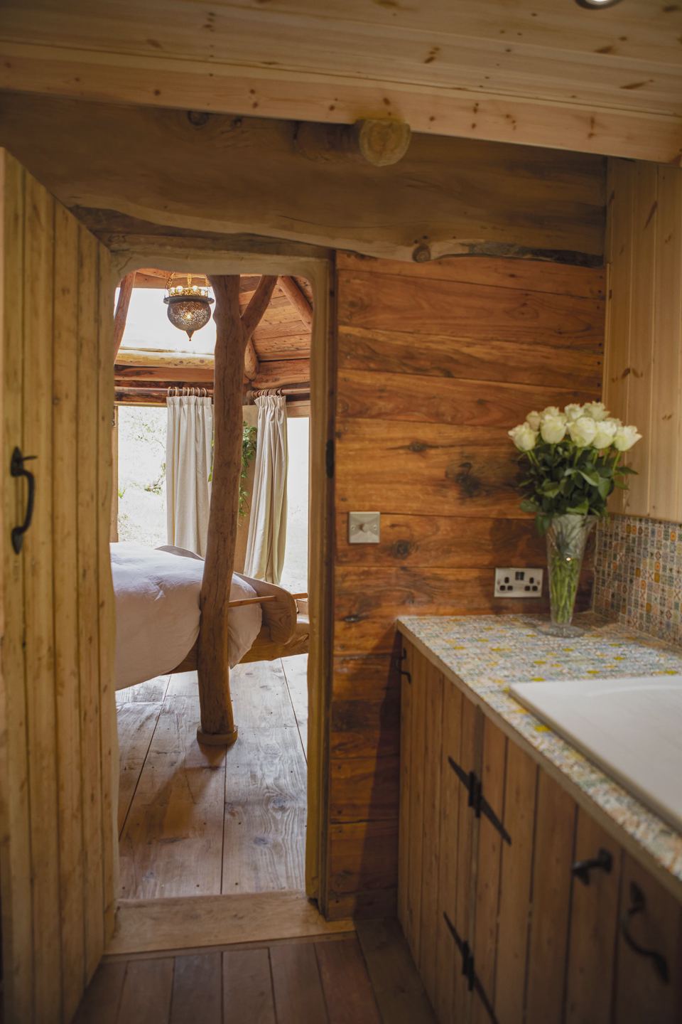 Kitchen with bedroom beyond
