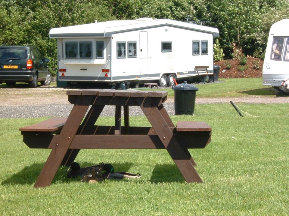 Picnic bench by a pitch