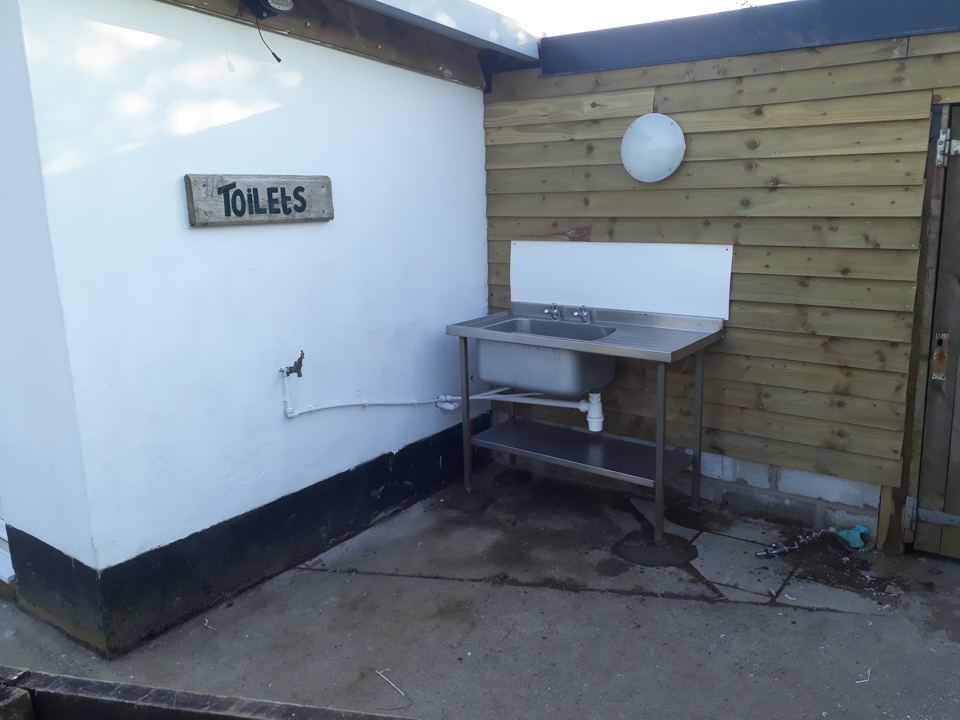 Outside toilet block with sink