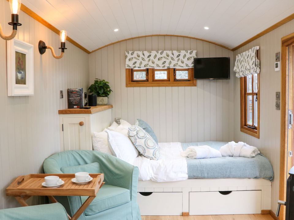 Inside the shepherd's hut bedroom