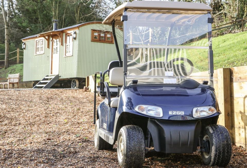 Hut beside a golf buggy