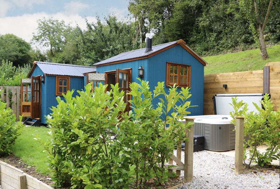 Blue hut beside the hot tub