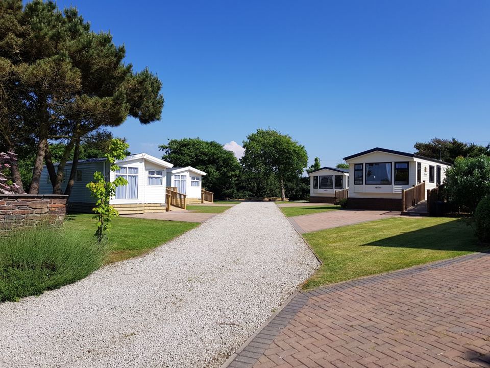 Static caravans beside the gravel track