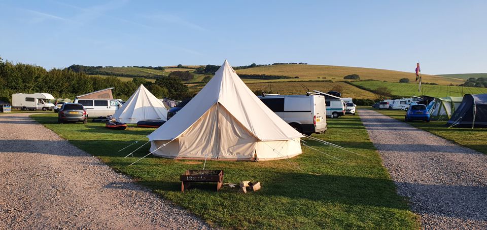 Bell tent among tents and vans