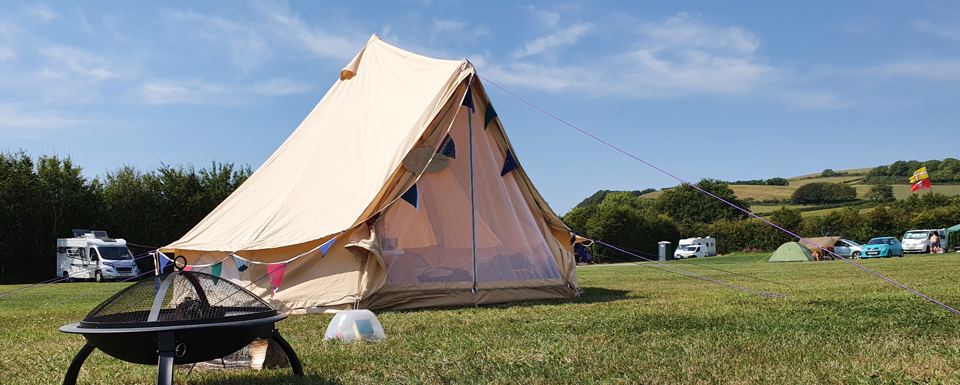 Bell tent with a fire pit