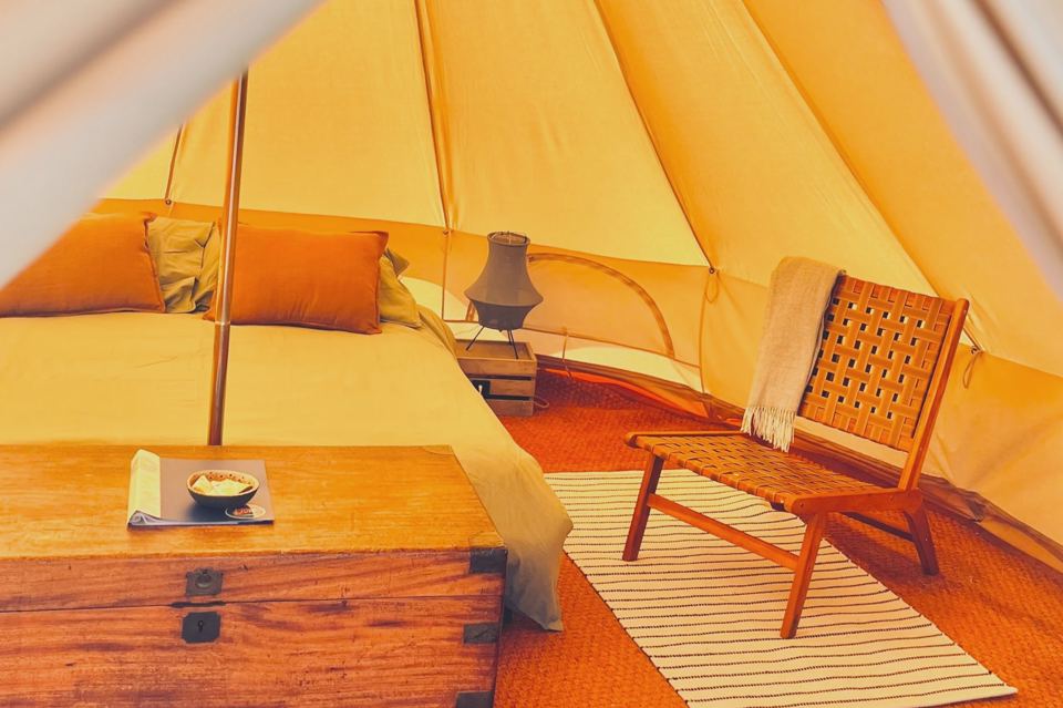 Inside a bell tent with a chair