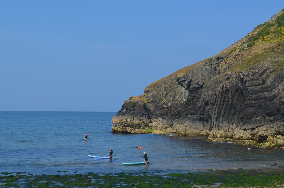 Paddleboarders in a nearby cove