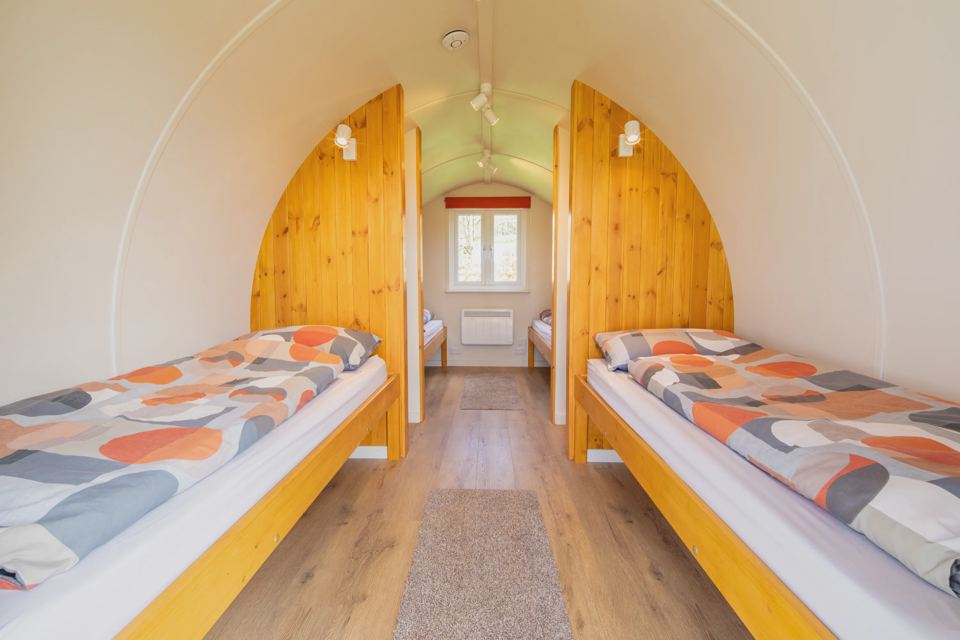 Single beds inside a pod