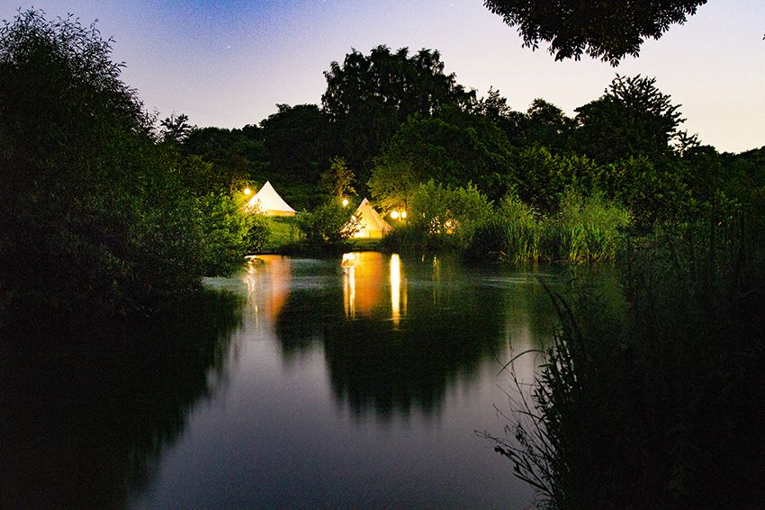 Lit tents at night