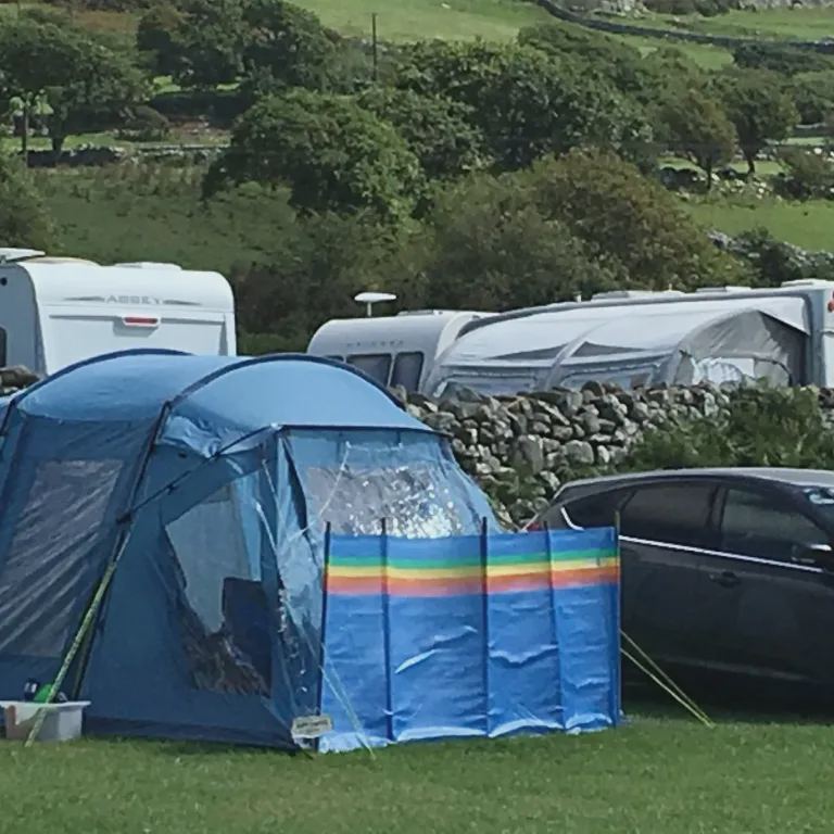 Tent and tourers on grass