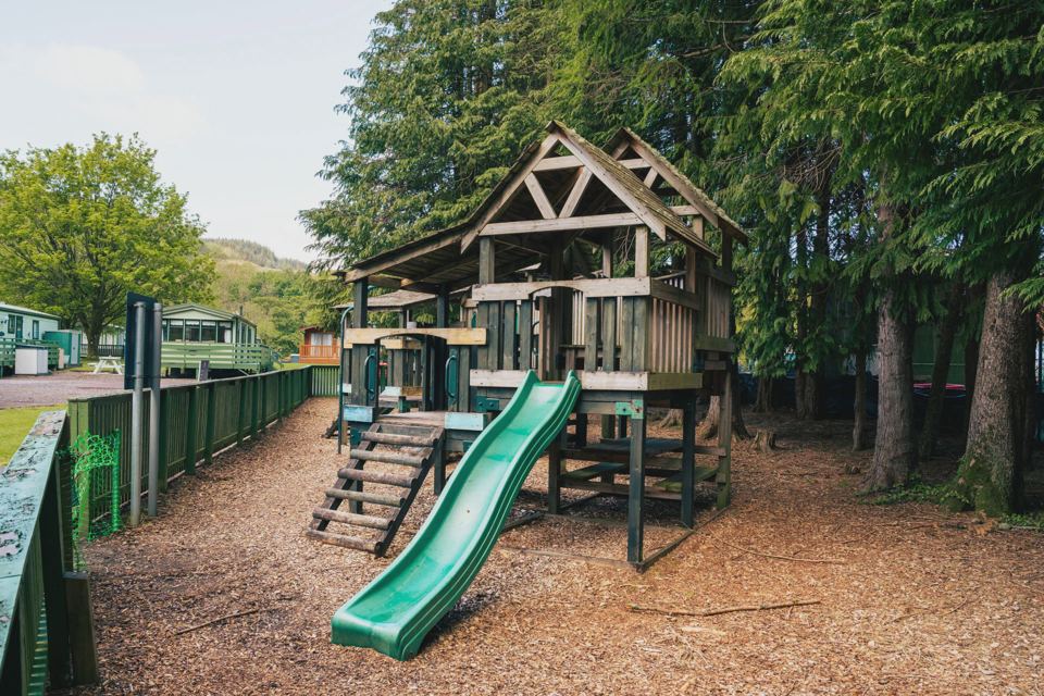 Wooden play tower and slide