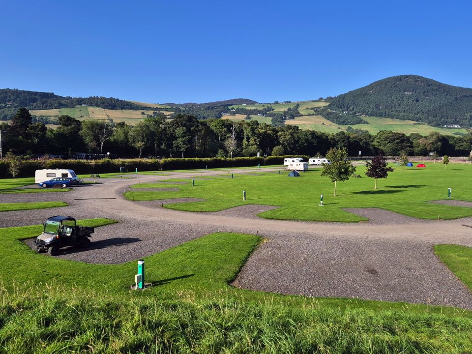 Hardstanding pitches with hills behind