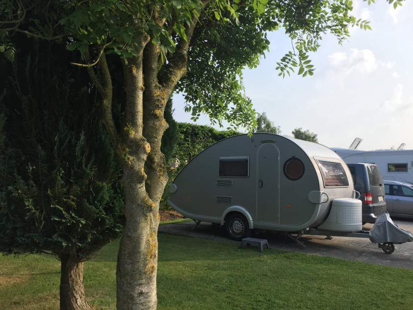 Teardrop caravan by the trees