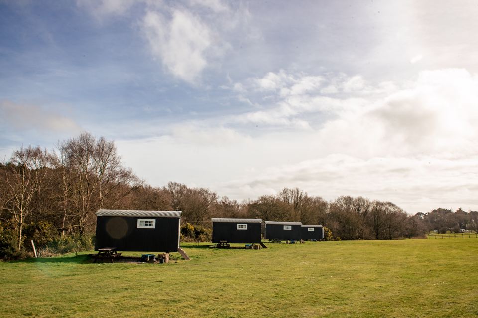 Shepherd huts across the field