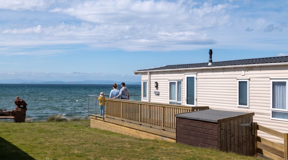 Caravan with deck by the sea