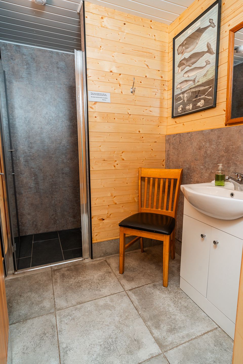 Shower room with sink and chair
