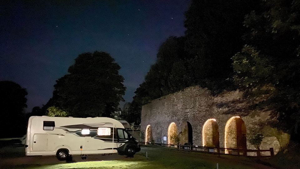 Motorhome by lit kiln arches